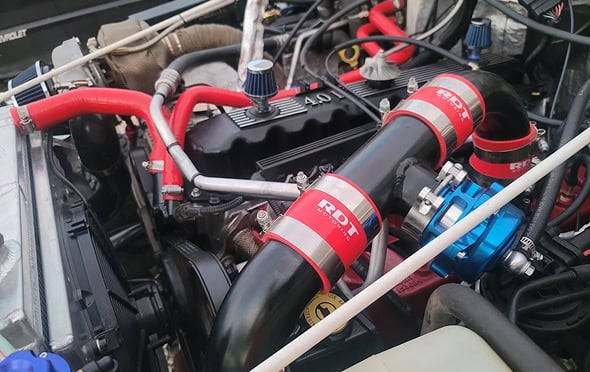 High-performance racing engine with custom parts and red accents.