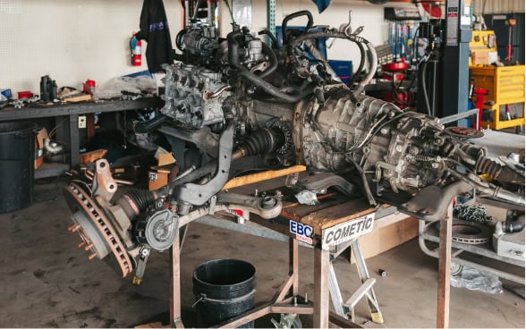High-performance racing engine on workbench at Black Market Racing.