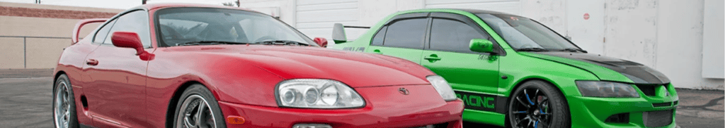 Two high-performance racing cars in vibrant colors at Black Market Racing.