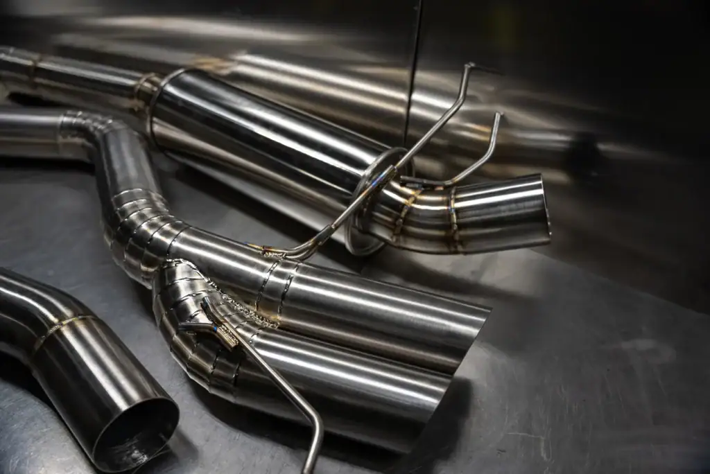 High-performance stainless steel exhaust pipes for racing cars.